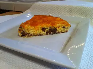 A slice of cheeseburger pie ready to eat.