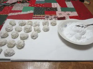 Roll the teacakes in powdered sugar.