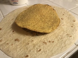 Cover beef and cheese with a crunchy tostada shell