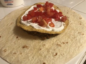 Sprinkle Tomatoes over the sour cream.